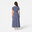 Women's floral V-neck midi dress by FJØRNA, elegant summer dress perfect for occasions and wedding guests.