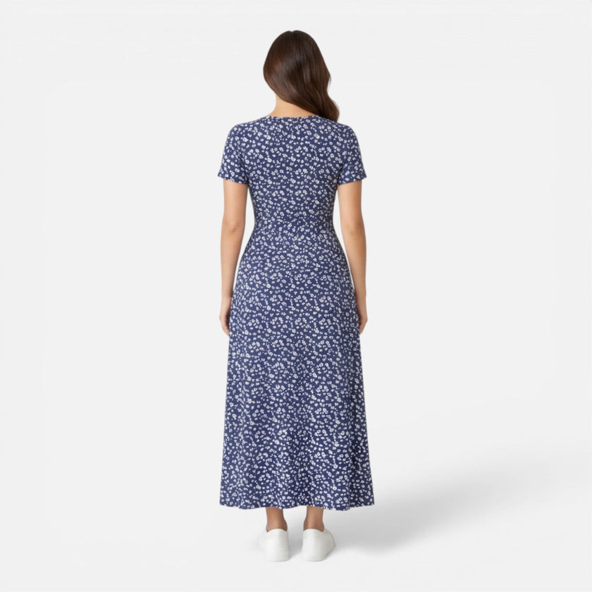Women's floral V-neck midi dress by FJØRNA, elegant summer dress perfect for occasions and wedding guests.