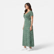 Women’s floral V-neck midi dress by FJØRNA featuring a feminine design, perfect for summer occasions and wedding guest attire.