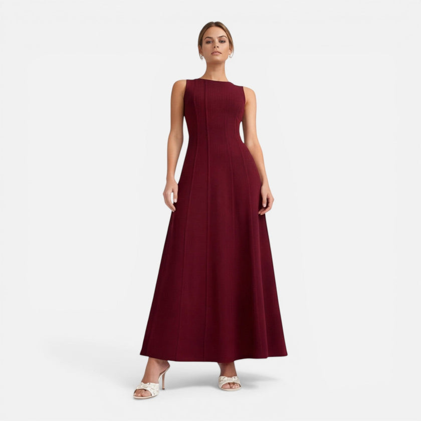 Elegant sleeveless women's formal maxi dress by FJØRNA with pleated design, perfect for wedding guest attire.