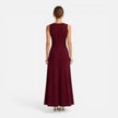 Women’s sleeveless formal maxi dress by FJØRNA with pleated design, suitable for wedding guests and special occasions.