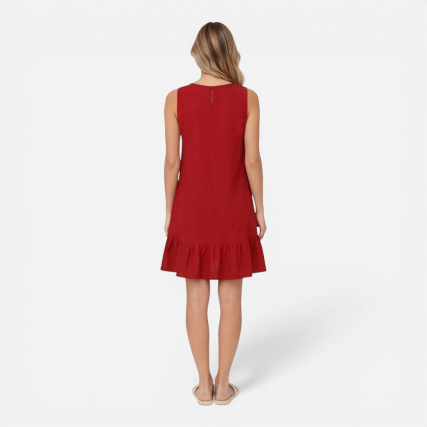 Women's lightweight sleeveless summer dress by FJØRNA with an A-line silhouette and ruffle hem, perfect for warm weather.