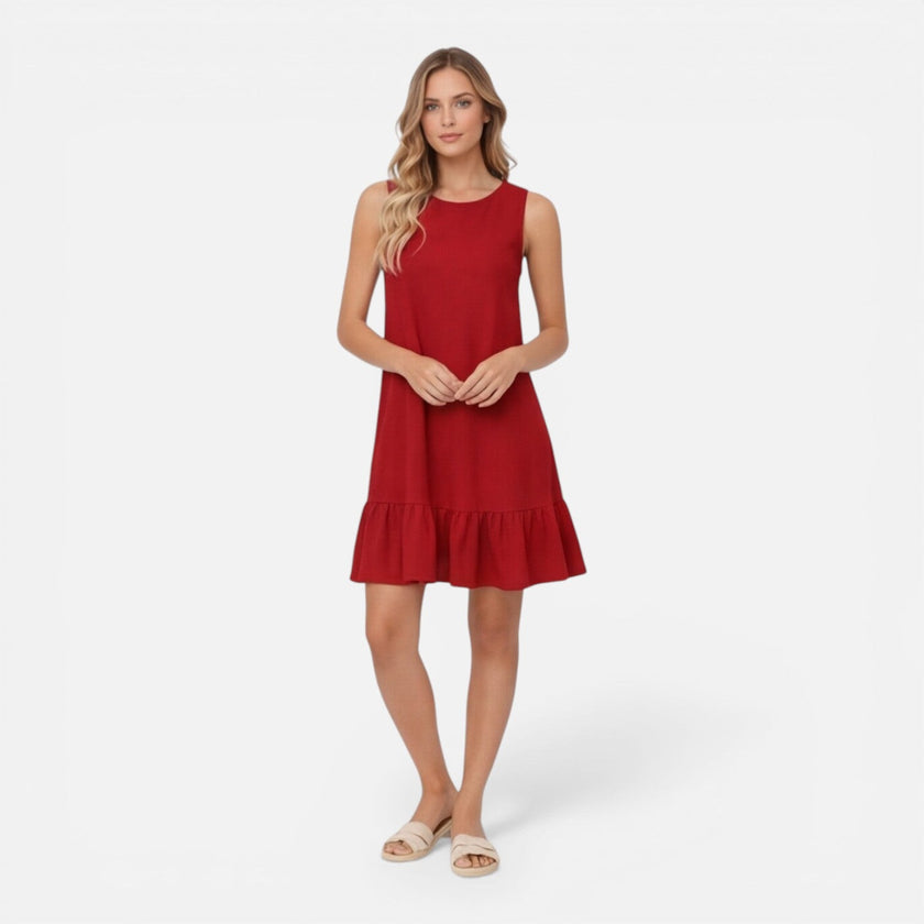 Women’s lightweight summer sleeveless dress by FJØRNA with an A-line silhouette and ruffle hem, perfect for warm weather.