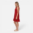 Women’s lightweight summer dress by FJØRNA featuring a sleeveless A-line design with ruffle hem, perfect for warm weather.