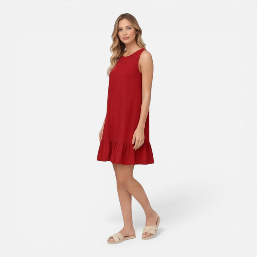 Women’s lightweight summer dress by FJØRNA featuring sleeveless design, A-line silhouette, and ruffle hem detail.