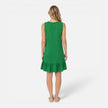 Women's lightweight summer sleeveless A-line dress with ruffle hem by FJØRNA, shown on a model in a bright outdoor setting.