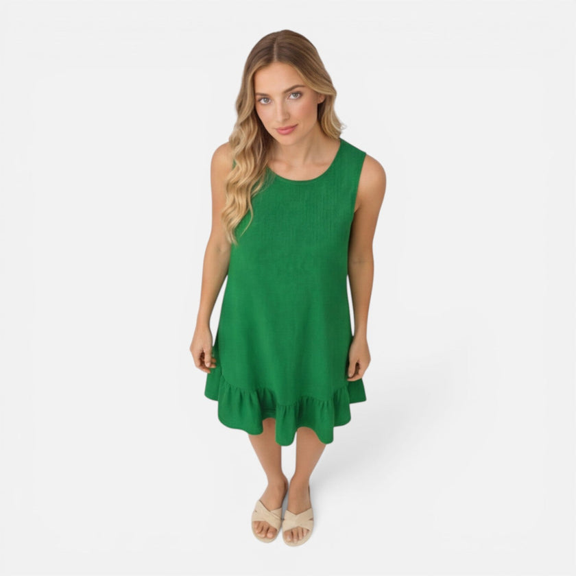 Women’s lightweight sleeveless summer dress by FJØRNA with an A-line silhouette and ruffle hem, perfect for warm weather.