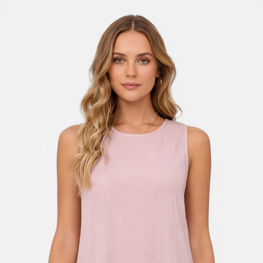 Women's lightweight sleeveless summer dress by FJØRNA with an A-line silhouette and ruffle hem, perfect for warm weather.
