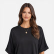 Women’s oversized cotton T-shirt by FJØRNA featuring a relaxed fit, lightweight breathable fabric, ideal for daily casual wear.