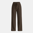 Women’s wide leg pleated trousers with elastic waistband by FJØRNA, showcasing stylish, flowy fabric and relaxed fit.