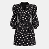 Women’s polka dot jumpsuit by FJØRNA featuring a V-neckline and puff sleeves, perfect for casual or semi-formal wear.