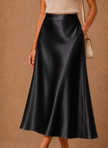 Women's satin midi skirt by FJØRNA featuring an elegant A-line design and flowing fabric, perfect for stylish occasions.