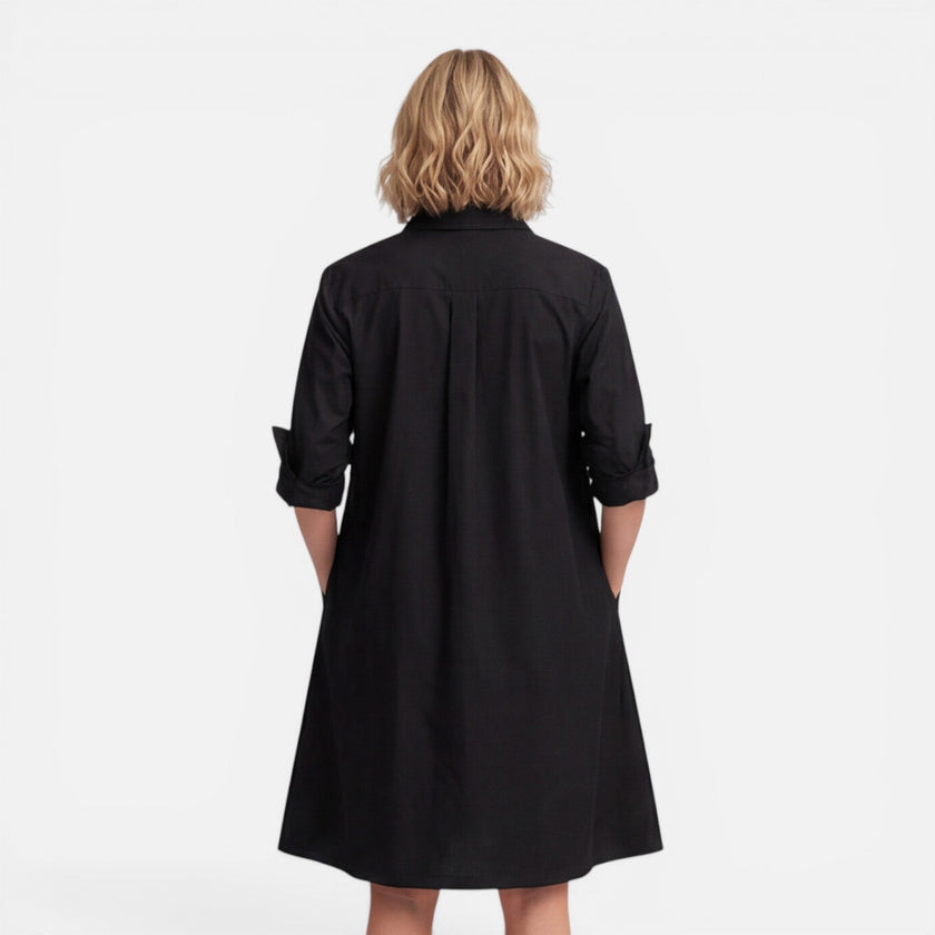 Women's lightweight FJØRNA shirt dress with a comfortable loose fit and midi length, perfect for casual wear.