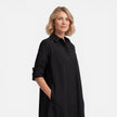 Women's lightweight FJØRNA shirt dress with a comfortable, loose fit midi style, ideal for casual and everyday wear.