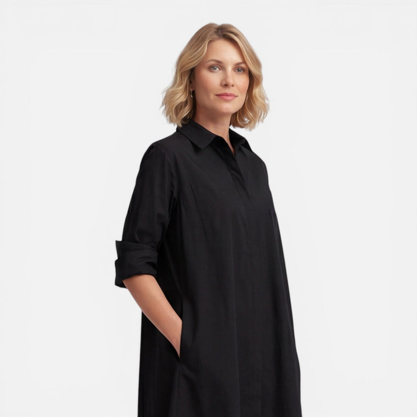 Women's lightweight FJØRNA shirt dress with a comfortable, loose fit midi style, ideal for casual and everyday wear.
