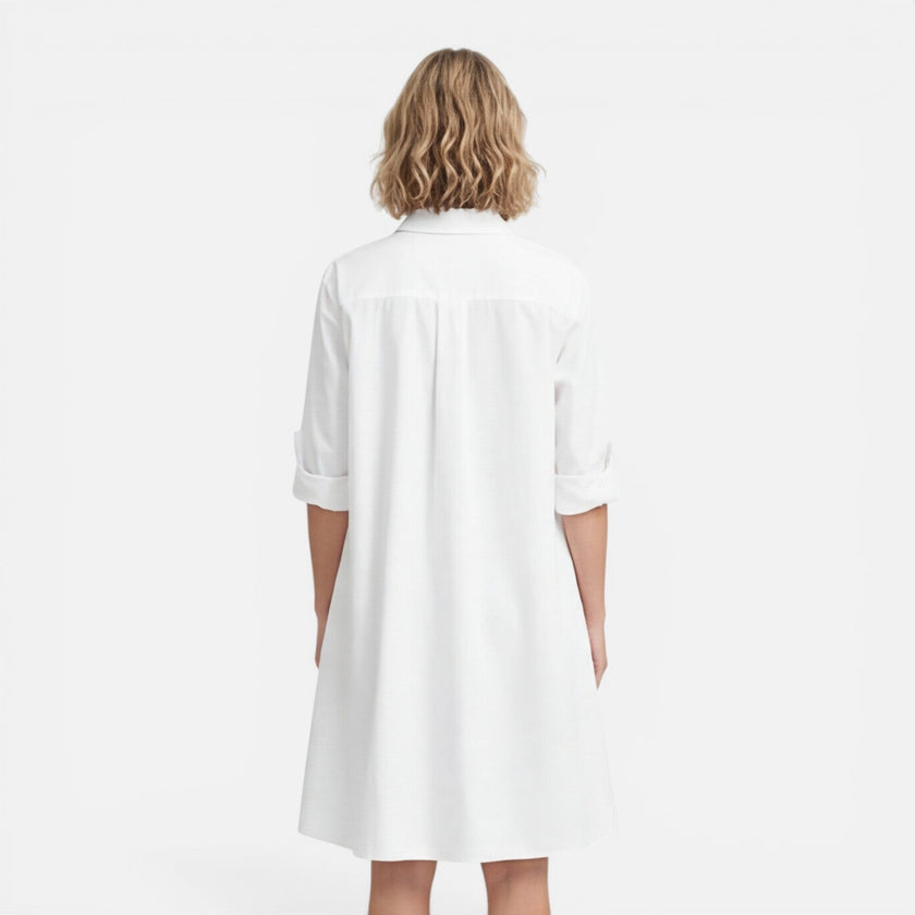 Lightweight women's shirt dress by FJØRNA featuring a loose fit and midi length, perfect for casual and comfortable wear.