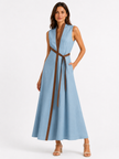 Women's FJØRNA sleeveless midi dress with stand collar, relaxed fit, and elegant style, shown on a model.