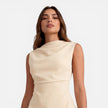 Elegant women's sleeveless mini dress by FJØRNA with a draped neckline, perfect for stylish occasions or wedding guest attire.