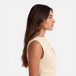 Women’s sleeveless mini dress by FJØRNA featuring an elegant draped neckline, perfect for special occasions and wedding guests.