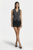 Women’s slim fit sleeveless waistcoat by FJØRNA in dark gray, tailored layering piece shown in full body shot.