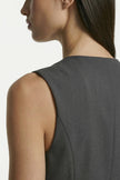 Dark gray women's slim fit sleeveless waistcoat by FJØRNA, close-up shot highlighting tailored tailoring and layering details.