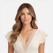 Women’s V-neck summer dress by FJØRNA featuring lightweight fabric, A-line silhouette, and lace waist detail.