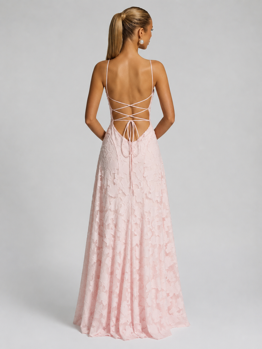 Women's floral embroidered strap maxi dress by FJØRNA, featuring a flowing silhouette and vibrant floral pattern.