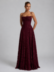 Women’s floral embroidered strap maxi dress by FJØRNA featuring a flowing silhouette and vibrant floral details.