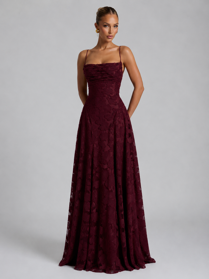 Women’s floral embroidered strap maxi dress by FJØRNA featuring a flowing silhouette and vibrant floral details.