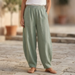 Women’s relaxed fit cotton linen wide-leg trousers by FJØRNA, showcasing comfortable, lightweight pants with a loose silhouette.