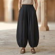 Women’s relaxed fit linen blend harem trousers with elastic waist by FJØRNA, showcasing a loose, comfortable design.