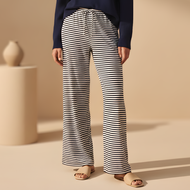 Women's FJØRNA striped drawstring trousers with a relaxed fit and comfortable waistband, perfect for casual wear.