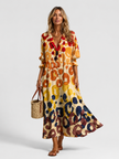 Women's floral print maxi shirt dress by FJØRNA featuring a button front and relaxed fit, perfect for casual or summer wear.