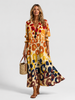 Women's floral print maxi shirt dress by FJØRNA featuring a button front and relaxed fit, perfect for casual or summer wear.