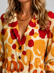 Women's floral print maxi shirt dress by FJØRNA with button front and relaxed fit, perfect for casual wear.