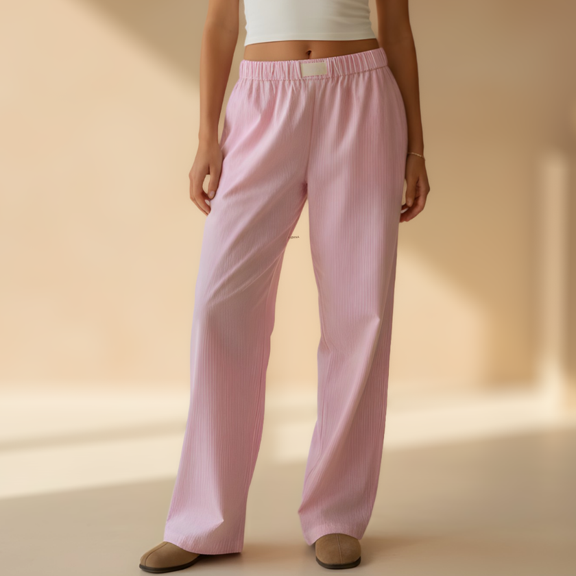 Women's FJØRNA lounge trousers with elastic waistband, soft fabric, and practical pockets, perfect for summer comfort and casual wear.