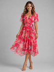 Women's floral V-neck midi dress by FJØRNA featuring flutter sleeves and a flowing silhouette, ideal for summer wear.