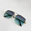 Women's retro aviator sunglasses with gold frame and gradient lenses, offering UV400 protection by FJØRNA.