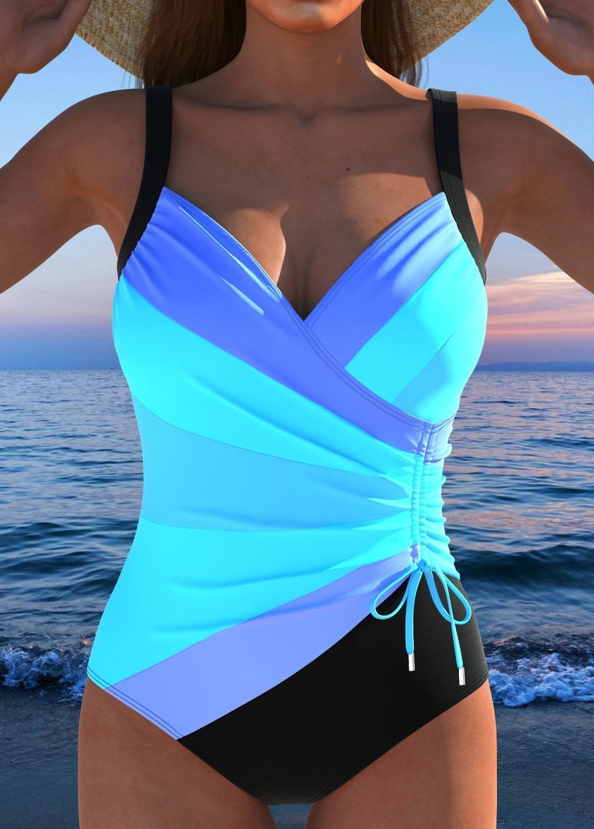 Women's FJØRNA tummy control printed one-piece swimsuit with stylish pattern and supportive fit, ideal for swimwear and beachwear.