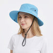 Women's wide brim sun hat by FJØRNA with breathable mesh for outdoor protection and stylish sun shading.