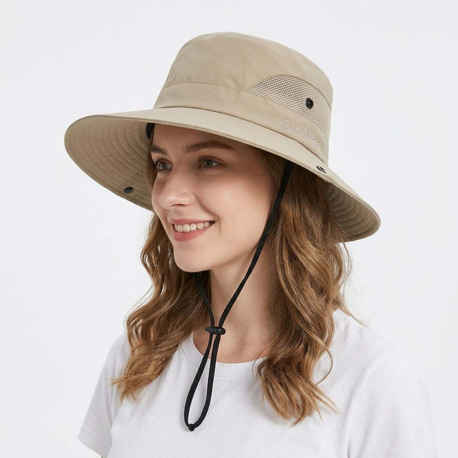Women's wide brim sun hat by FJØRNA with breathable mesh for outdoor sun protection.