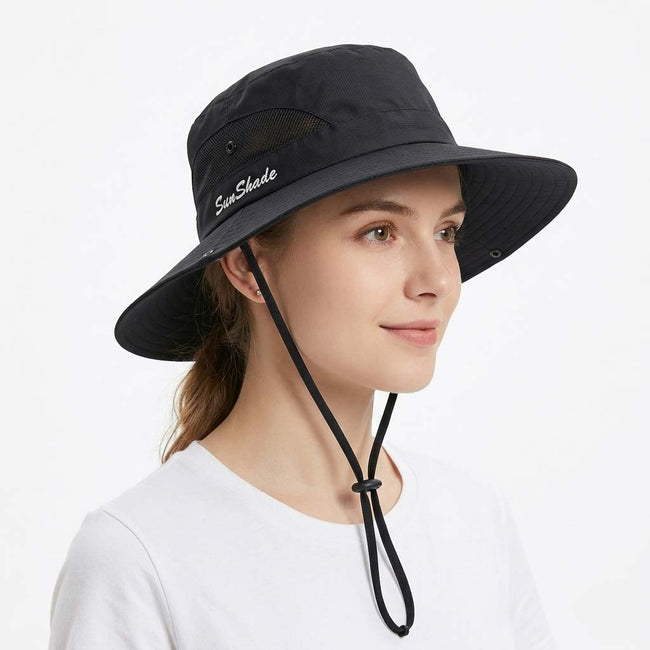 Women's wide brim sun hat by FJØRNA with breathable mesh, designed for outdoor sun protection and stylish summer wear.