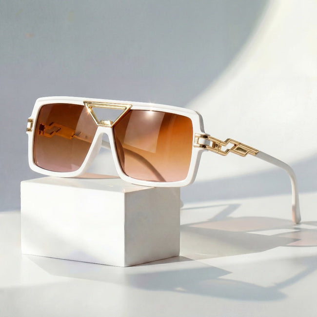 Women's retro square sunglasses with gold chain link detail and UV protection by FJØRNA, showcasing stylish eyewear.