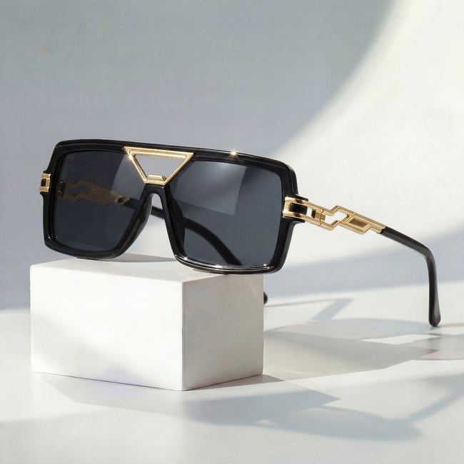 Women's retro square sunglasses by FJØRNA with gold chain link detail and UV protection, stylish eyewear for sunny days.