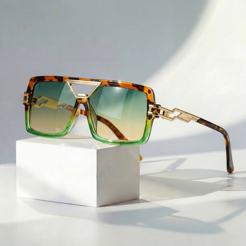Women's retro square sunglasses with gold chain link and UV protection by FJØRNA, stylish eyewear for sunny days.