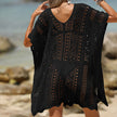FJØRNA women's short sleeve hollow-out cover-up mini dress with stylish cut-out details on lightweight fabric.