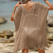 FJØRNA women's short sleeve hollow-out cover-up mini dress with stylish cut-out details, perfect for beach or poolside wear.