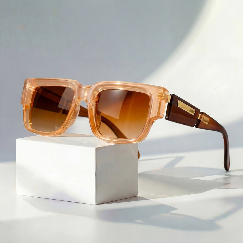 Women's square sunglasses with thick frames and wide temples, stylish FJØRNA sunglasses for sun protection and fashion.