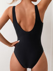 Women's FJØRNA scoop neck swimsuit with contrast side panel print, showcasing a stylish and fitted design.