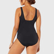 Women's FJØRNA square neck swimsuit with a vibrant multi-pattern print, featuring a stylish and athletic design.